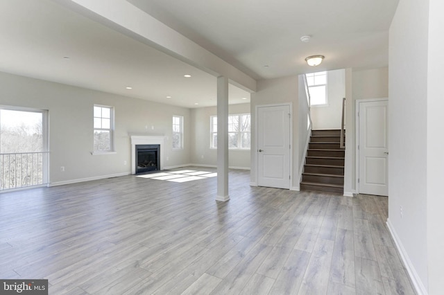 unfurnished living room with light hardwood / wood-style floors