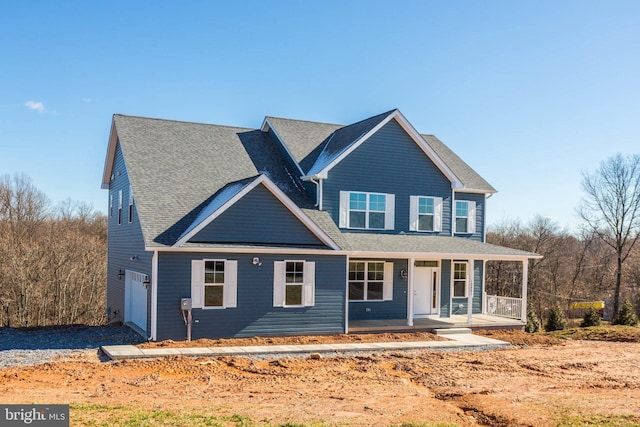 view of front of house with a porch and a garage