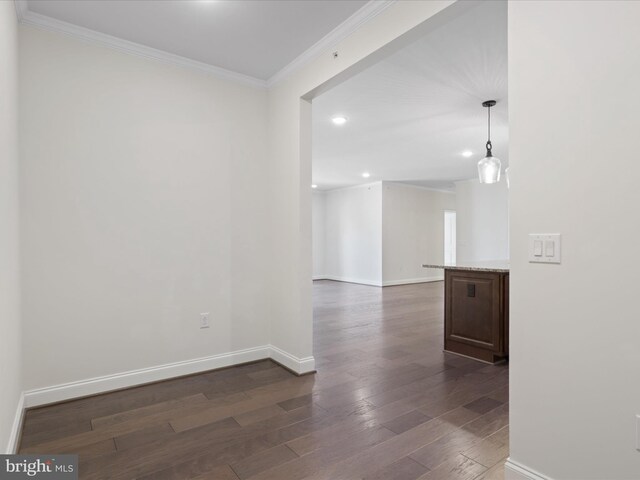 interior space featuring hardwood / wood-style flooring, crown molding, and independent washer and dryer