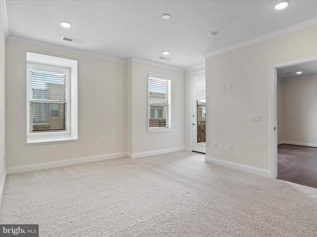 spare room with crown molding and dark hardwood / wood-style flooring