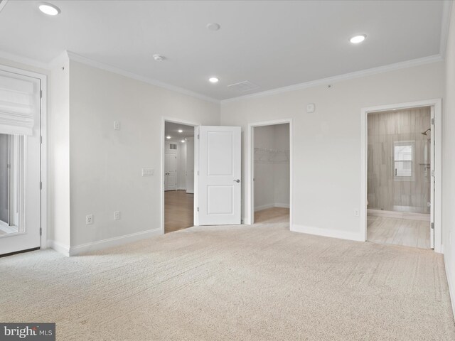 carpeted bedroom featuring crown molding