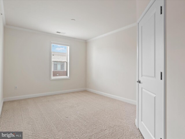 carpeted bedroom with ornamental molding