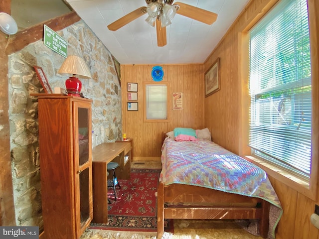 bedroom with wood walls