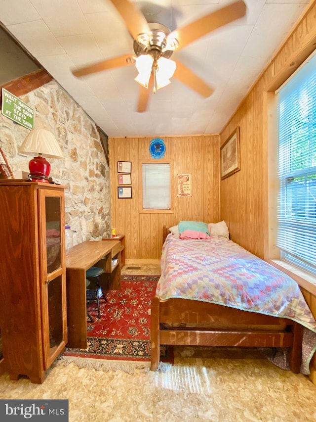 bedroom with wooden walls