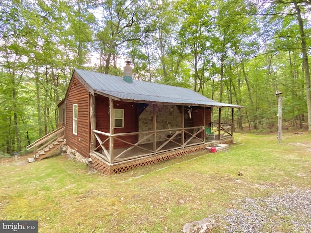 view of outbuilding featuring stairway