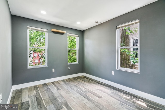 spare room with light wood-type flooring