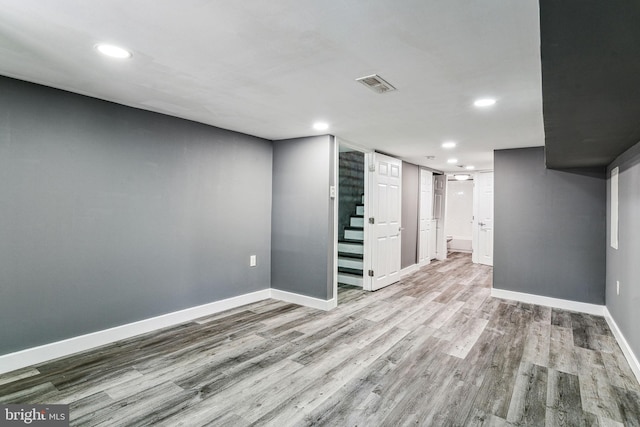 basement featuring light hardwood / wood-style floors