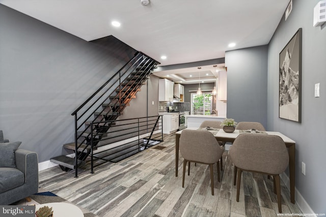 dining area with light hardwood / wood-style flooring