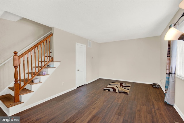 unfurnished room with dark hardwood / wood-style floors