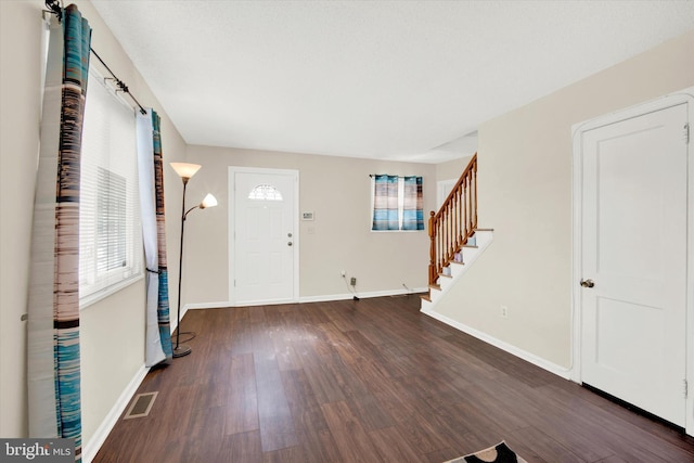 foyer with dark wood-type flooring