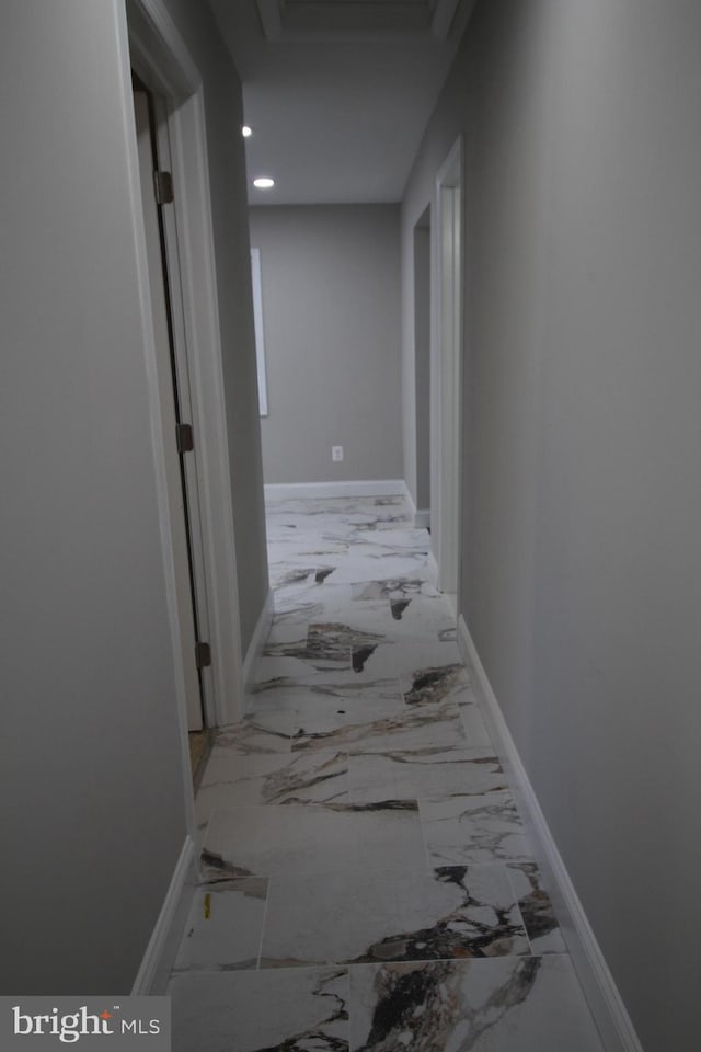 hall with marble finish floor, recessed lighting, attic access, and baseboards