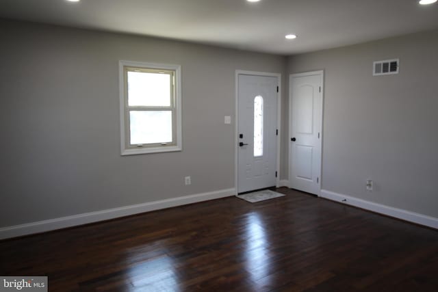 entrance foyer with recessed lighting, dark wood-style flooring, visible vents, and baseboards