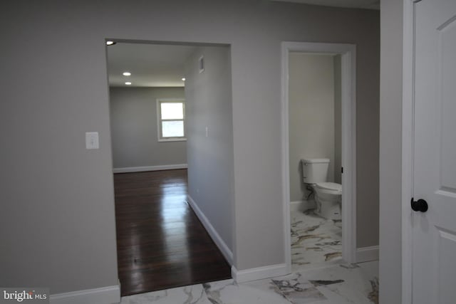 hall with hardwood / wood-style floors