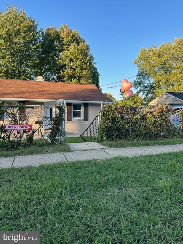 view of home's exterior with a lawn and a chimney