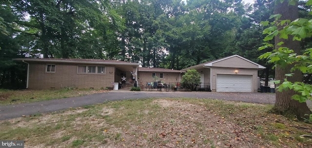 ranch-style house featuring a garage