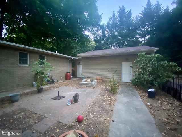 rear view of property featuring a patio