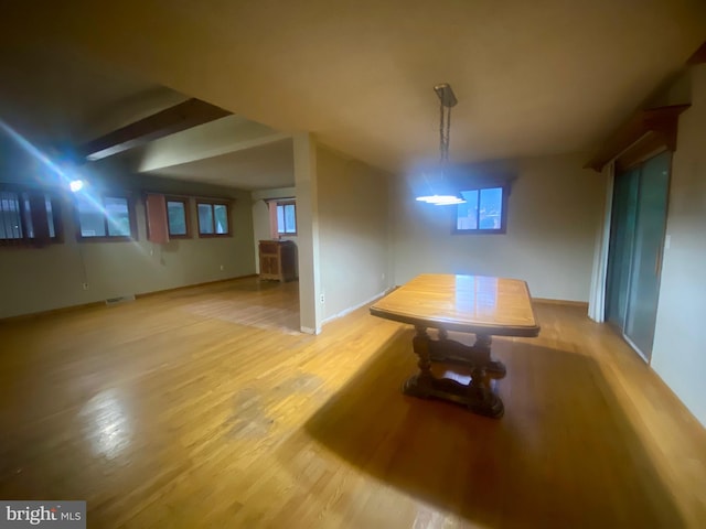 unfurnished dining area with light wood-type flooring