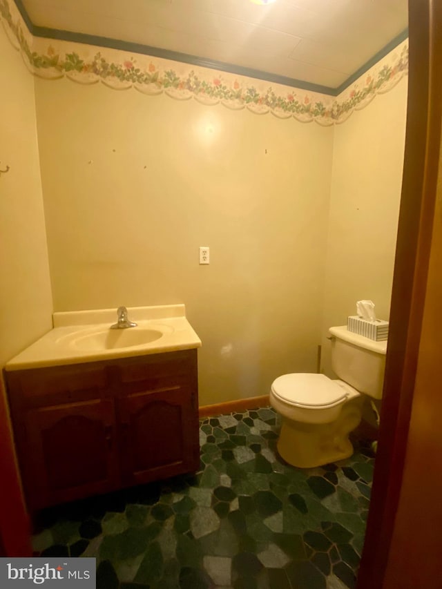 bathroom featuring vanity and toilet