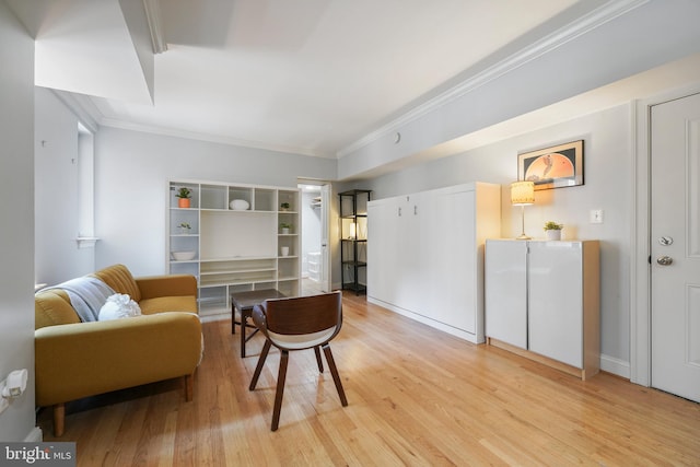 living area with light wood finished floors and ornamental molding