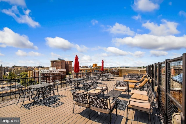 wooden terrace featuring a view of city