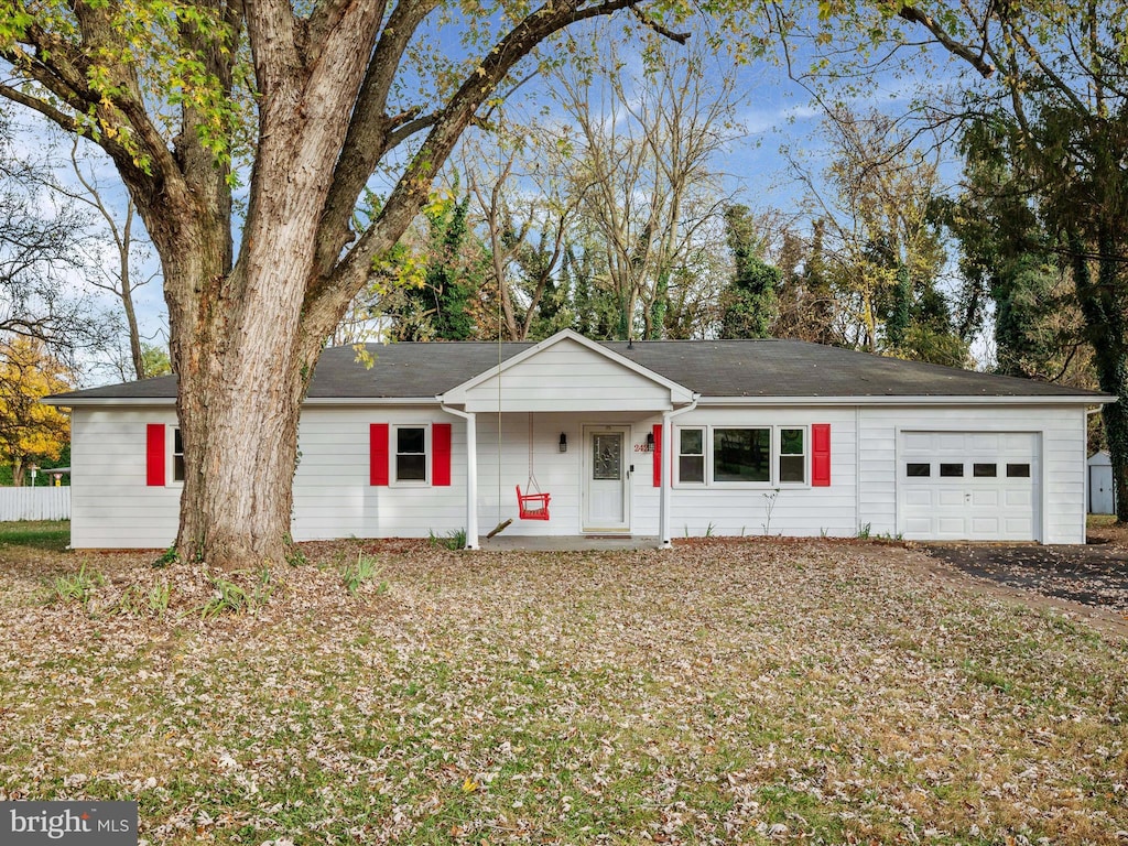 ranch-style home featuring a garage