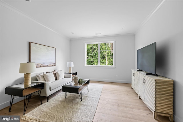 living room with crown molding and light wood-type flooring