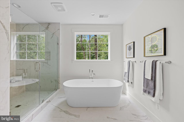 bathroom featuring tile patterned flooring and independent shower and bath