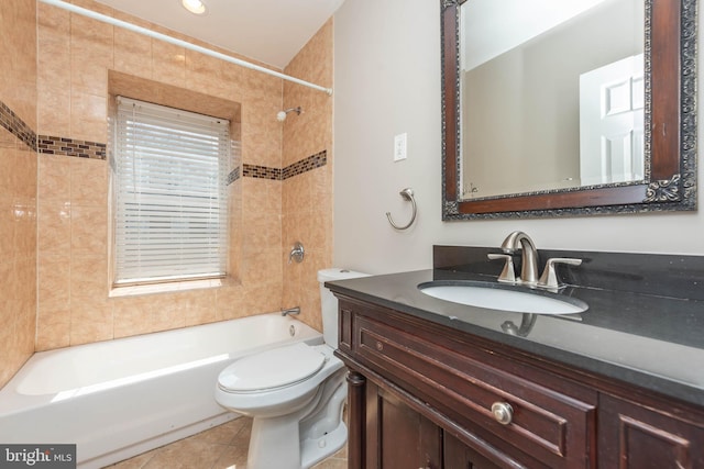 bathroom with toilet, bathing tub / shower combination, tile patterned flooring, and vanity