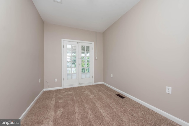 carpeted empty room with baseboards and visible vents