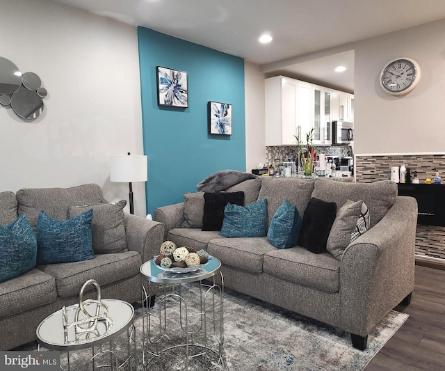 living room with dark hardwood / wood-style flooring