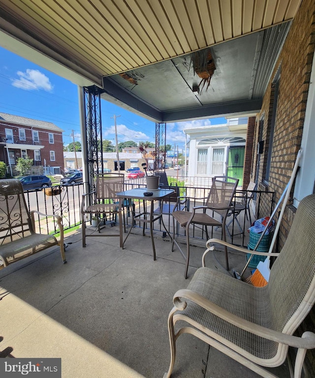 view of patio featuring ceiling fan