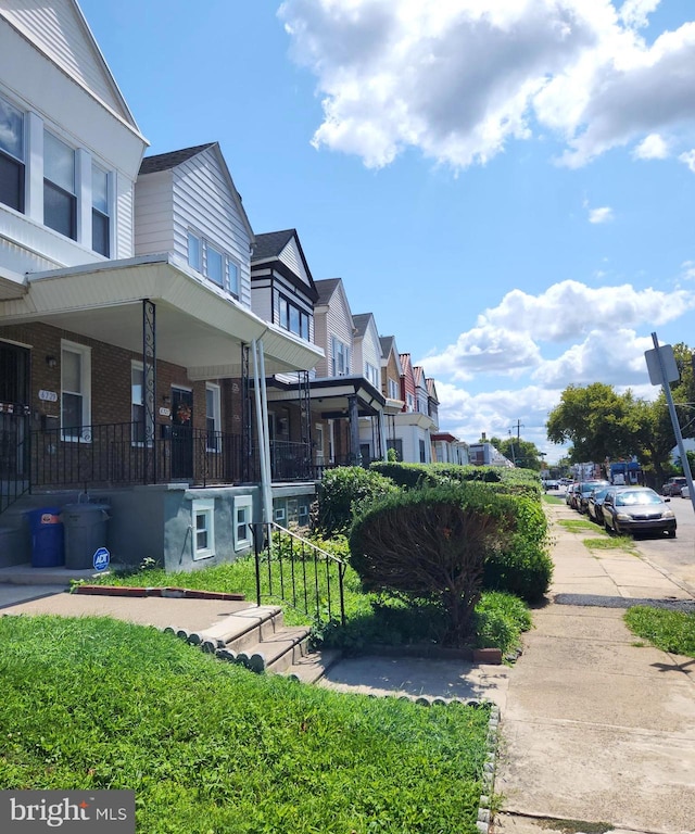 view of yard with covered porch