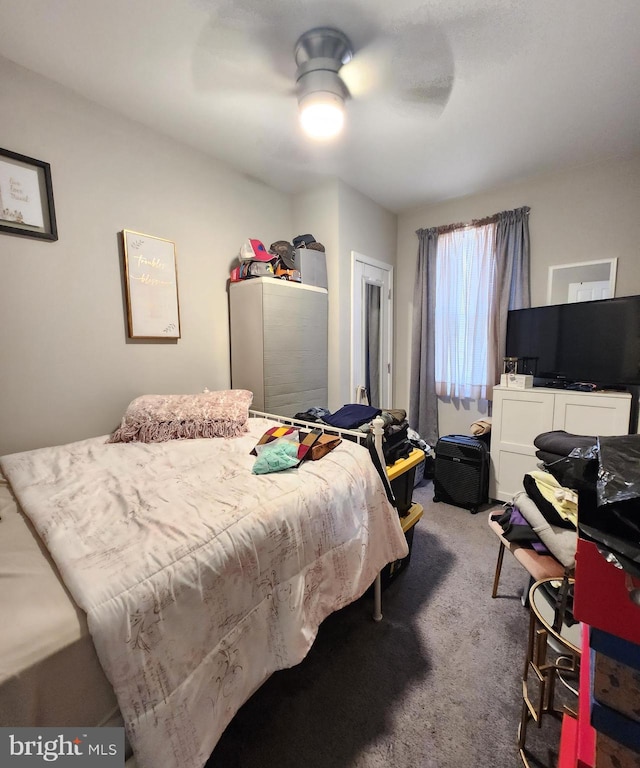 bedroom with ceiling fan and carpet flooring