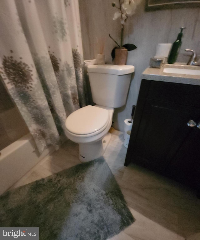 full bathroom with vanity, toilet, and shower / bath combo with shower curtain