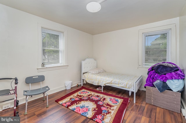 bedroom with hardwood / wood-style flooring