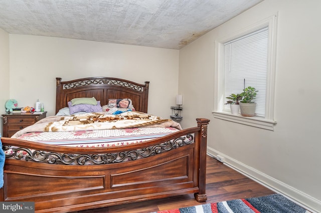 bedroom with dark wood-type flooring