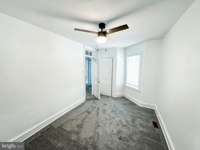 unfurnished bedroom featuring ceiling fan and carpet flooring