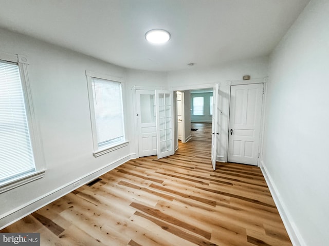 unfurnished bedroom with light hardwood / wood-style floors