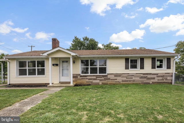 ranch-style house with a front lawn