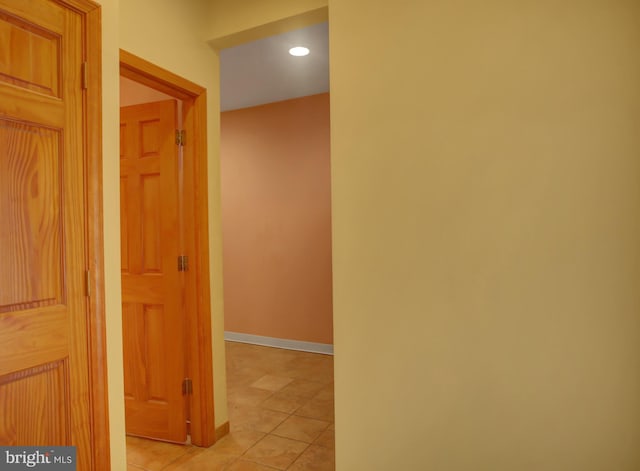 hallway featuring light tile patterned flooring