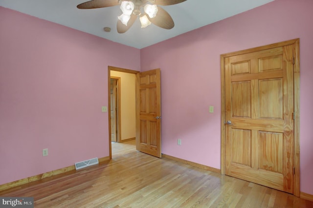 unfurnished bedroom featuring ceiling fan and light hardwood / wood-style flooring