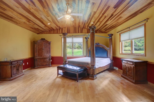 bedroom featuring lofted ceiling, multiple windows, and wooden ceiling