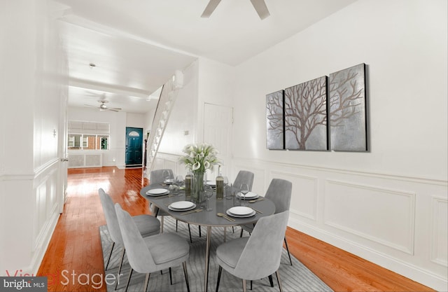 dining space featuring hardwood / wood-style flooring and ceiling fan