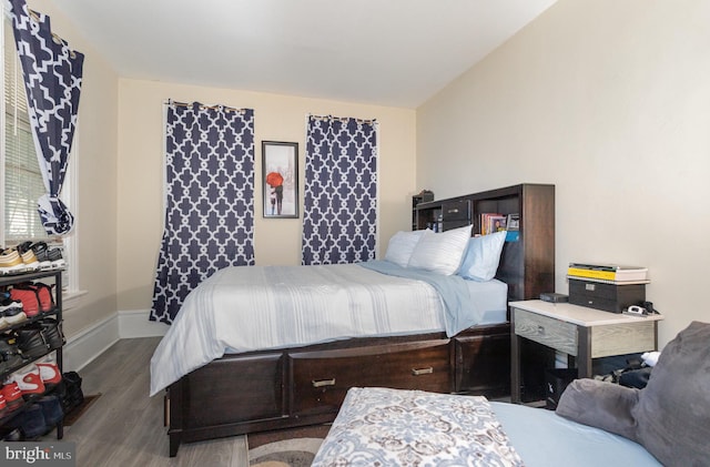 bedroom with wood-type flooring