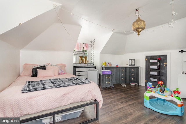 bedroom featuring lofted ceiling and dark hardwood / wood-style flooring