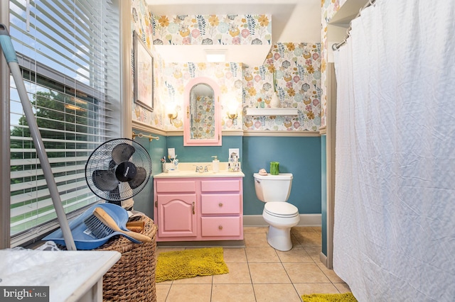 bathroom featuring tile patterned floors, vanity, and toilet