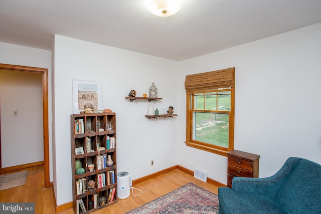 living area with light hardwood / wood-style flooring