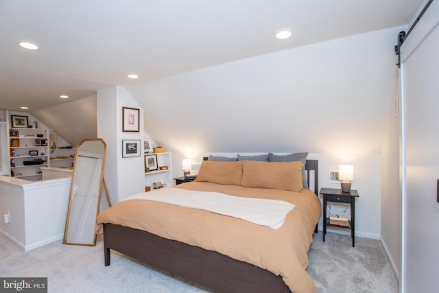 bedroom featuring light colored carpet and vaulted ceiling