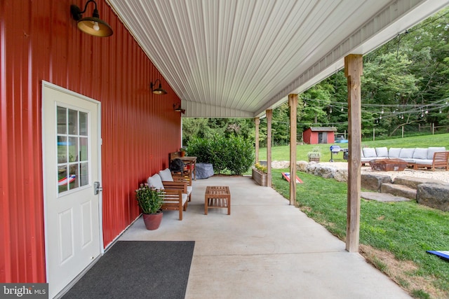 view of patio / terrace featuring a storage unit