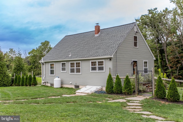 back of house with a yard